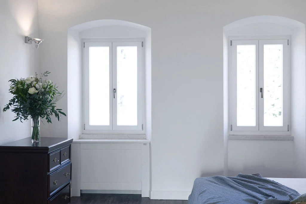 Windows in bedroom with bedroom funiture