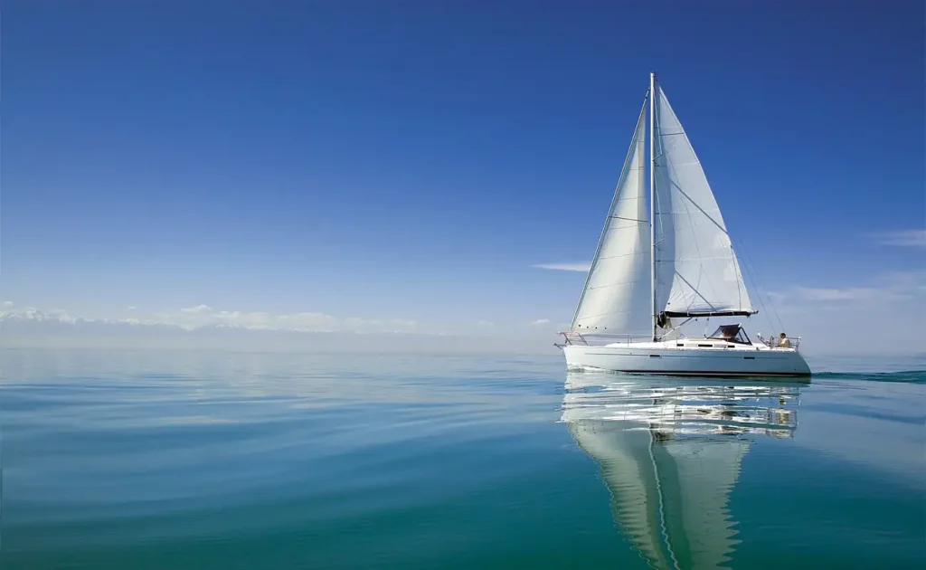 A small sailing boat on calm waters
