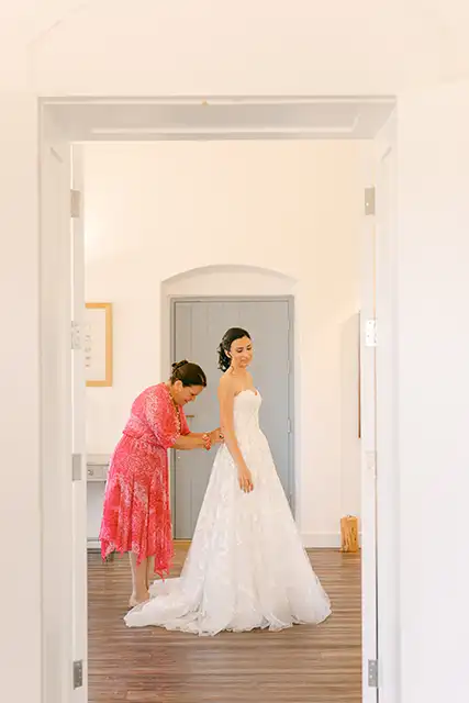 Bride getting dressed.