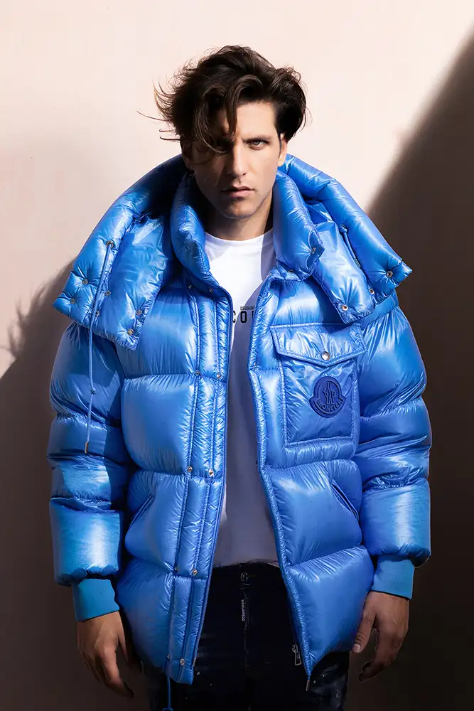 Model wearing blue puffa jacket.