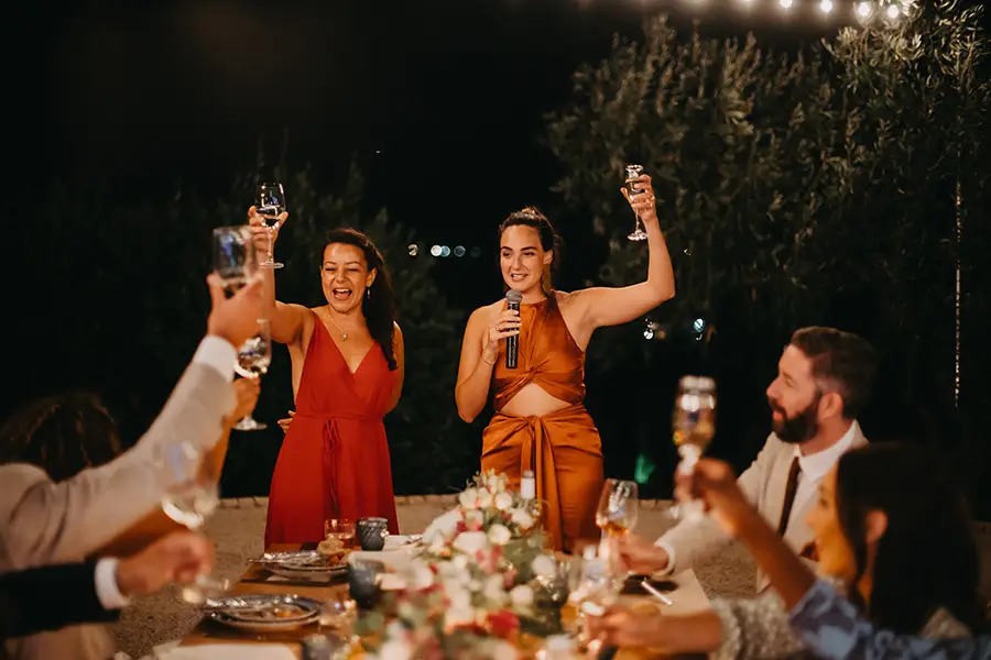 Guests raising glasses during reception