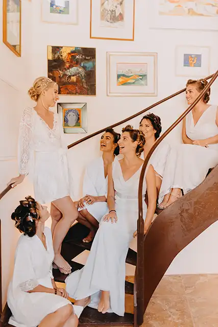 Bride and bridesmaids on stairs