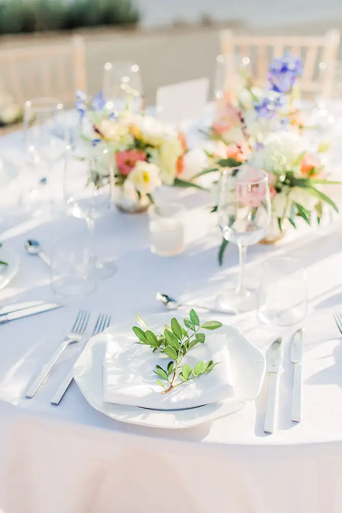 Wedding reception table with floral table decorations.